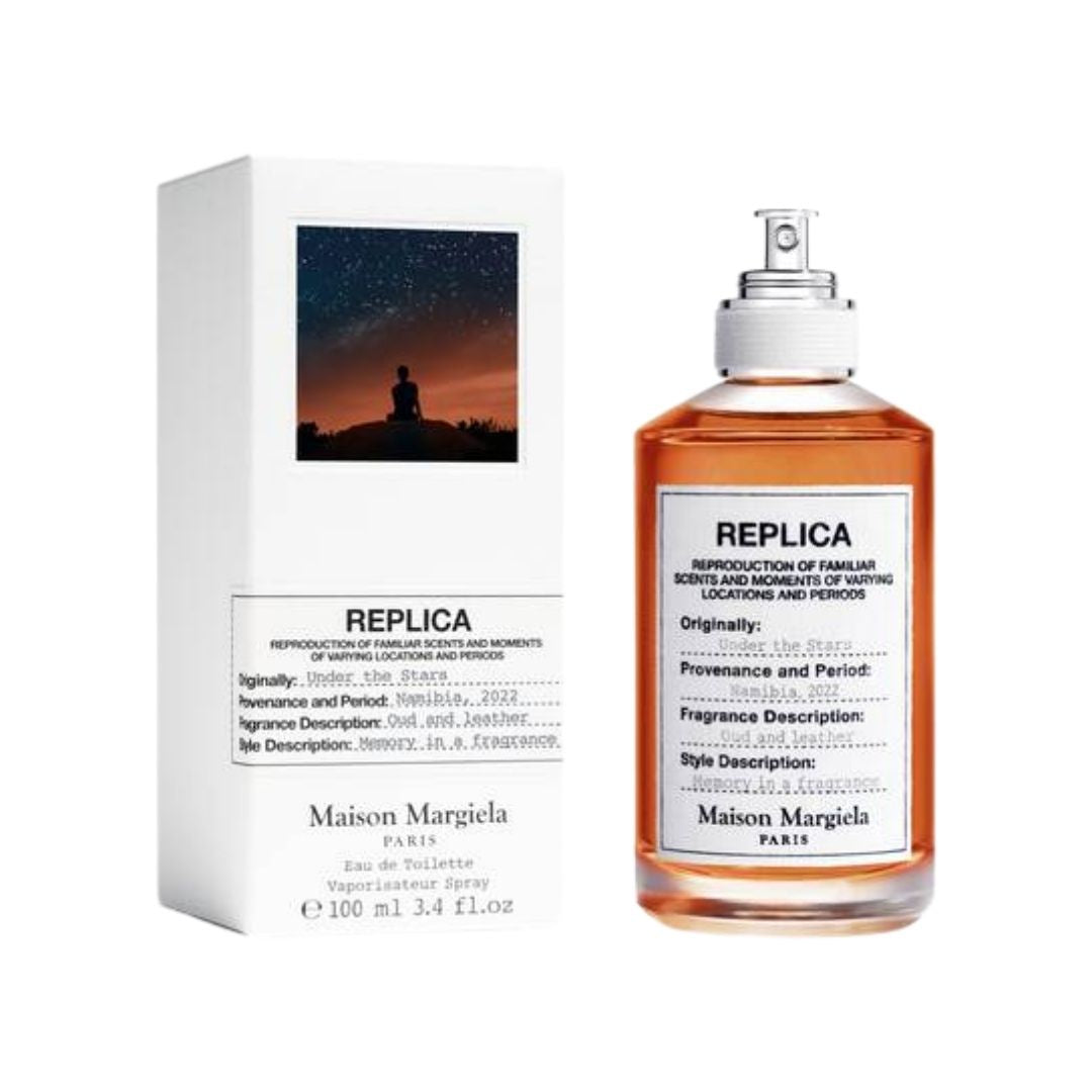 Maison Margiela Replica Under The Stars 100ml EDT, a clear bottle with a dark liquid, evoking a warm, woody, and spicy night-time scent in NZ