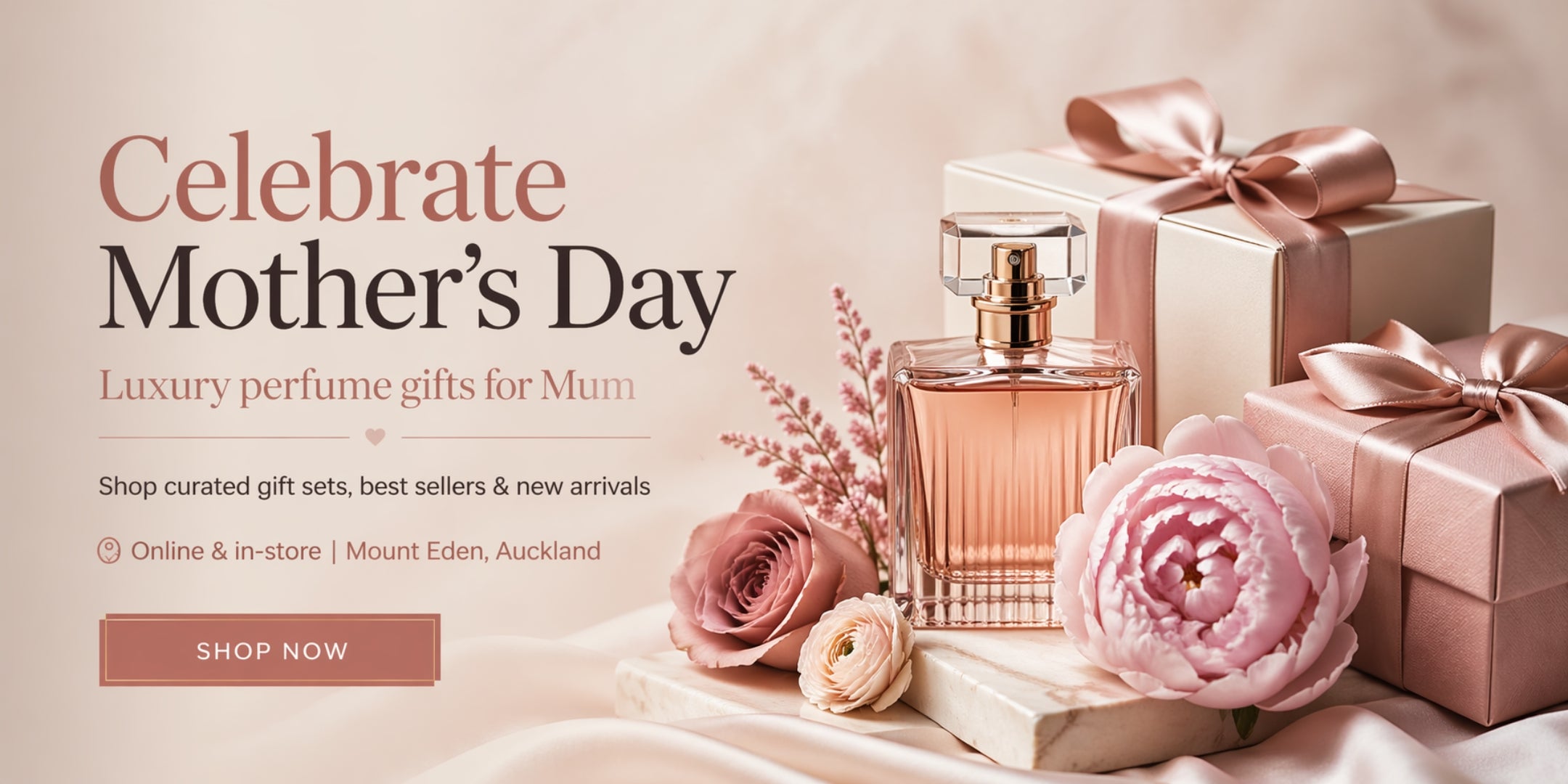 Mother's Day advertisement with perfume, flowers, and gift boxes on a soft pink background.