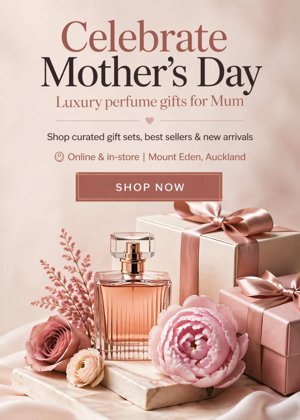 Advertisement for Mother's Day perfume gifts with a bottle, flowers, and gift boxes on a soft pink background.