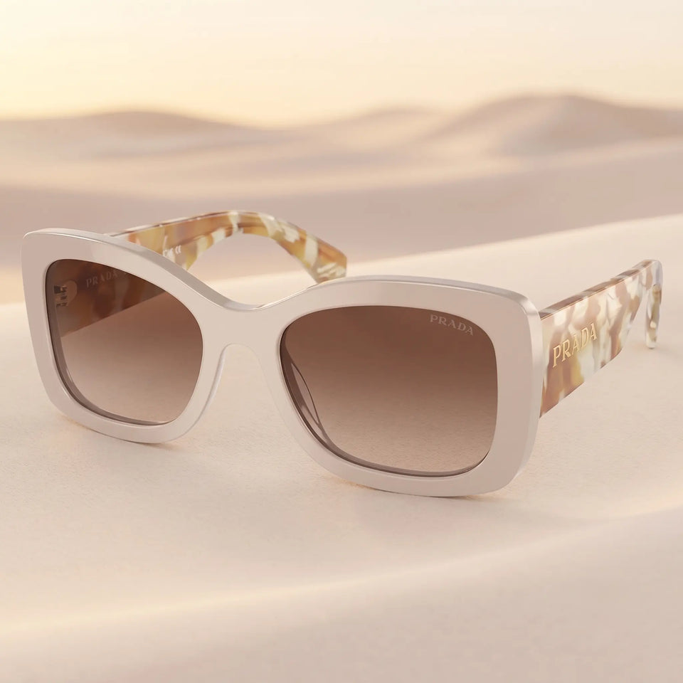Prada PR A08S 11O6S1 - Side Angle of Desert Frame and Brown Gradient Lenses
