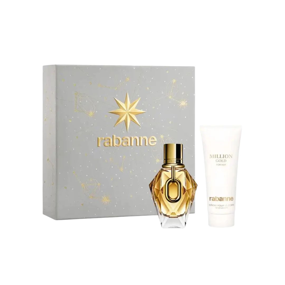 Rabanne Million Gold For Her EDP 50ml 2pc Gift Set featuring a faceted gold perfume bottle, a white body wash tube, and a silver-gray gift box with gold star details, all on a white background.