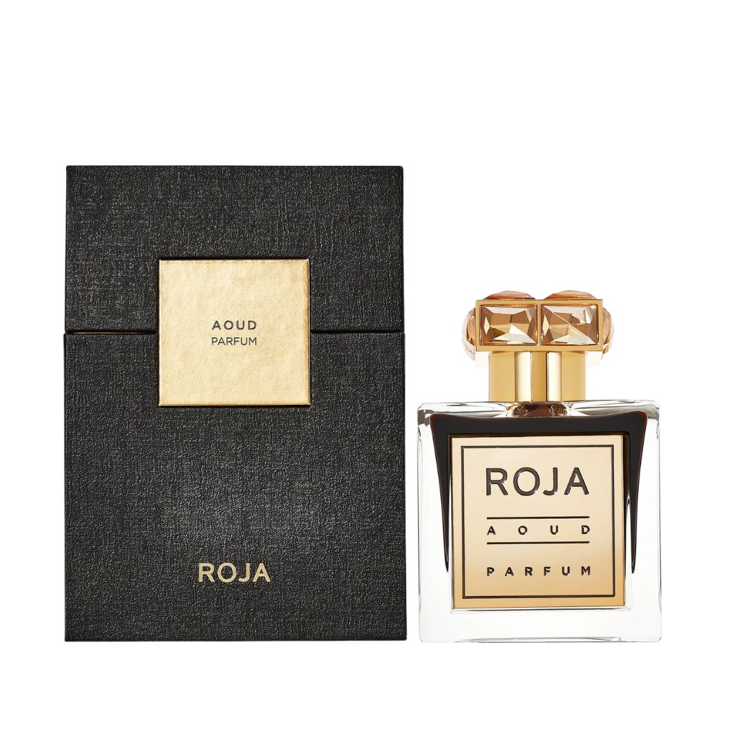 Roja Parfums Aoud 100ml Parfum, a luxurious clear bottle with a gold plaque and gemstone cap, suggesting a rich, intensely woody, and opulent unisex fragrance.