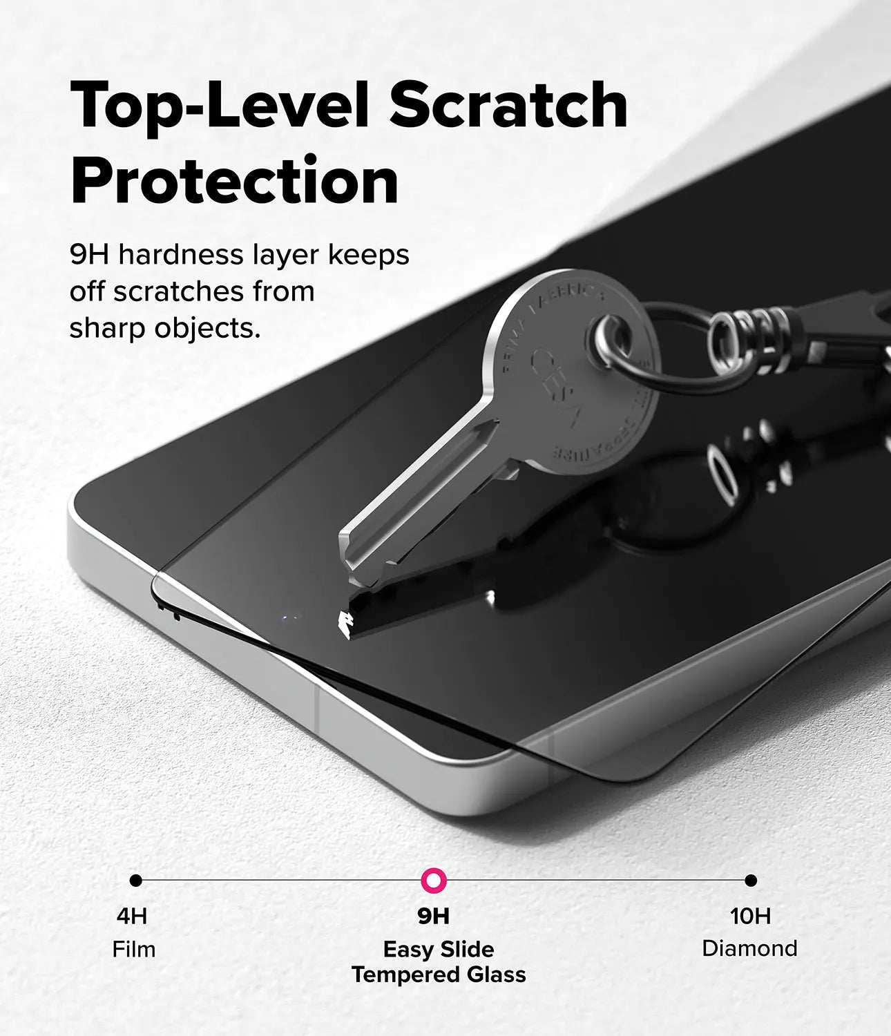 Smartphone with tempered glass screen protector and keychain, highlighting scratch protection.