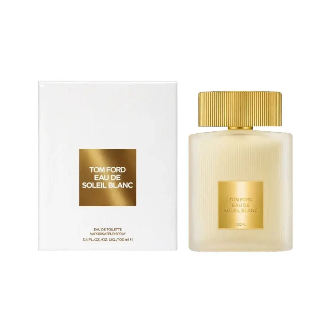 Tom Ford Eau de Soleil Blanc perfume bottle next to its white packaging box, both featuring a gold label and gold cap on a white background.