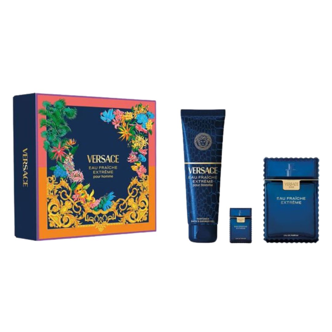 Versace Eau Franchise Extreme gift set featuring a large floral-patterned box, a blue body lotion tube, a small matching bottle, and a blue rectangular fragrance box on a white background.