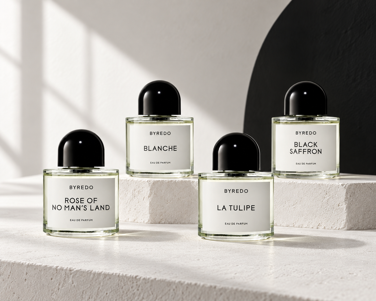 Byredo Rose of No Man’s Land, Blanche, Black Saffron and La Tulipe bottles in a quiet white gallery setting.