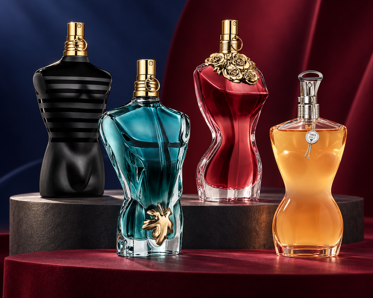 Jean Paul Gaultier Le Male Le Parfum, Le Beau, La Belle and Classique bottles on a navy and claret couture stage