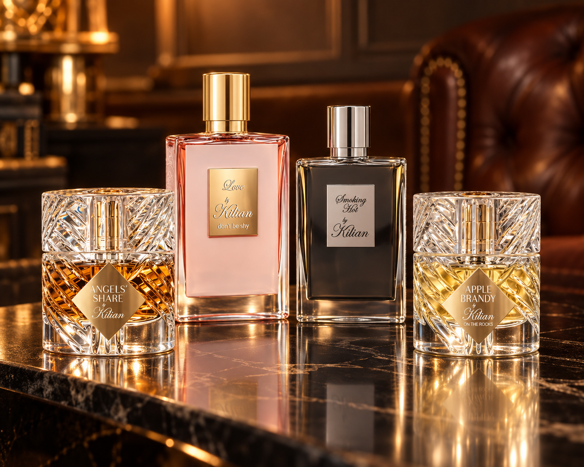 Kilian Angels’ Share, Love Don’t Be Shy, Smoking Hot and Apple Brandy on the Rocks bottles in an amber-lit salon.