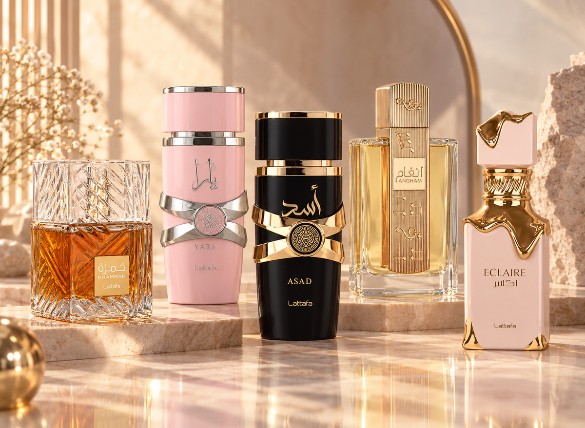 Lattafa Khamrah, Yara, Asad, Angham and Eclaire bottles in warm ivory and rose-sand surroundings.