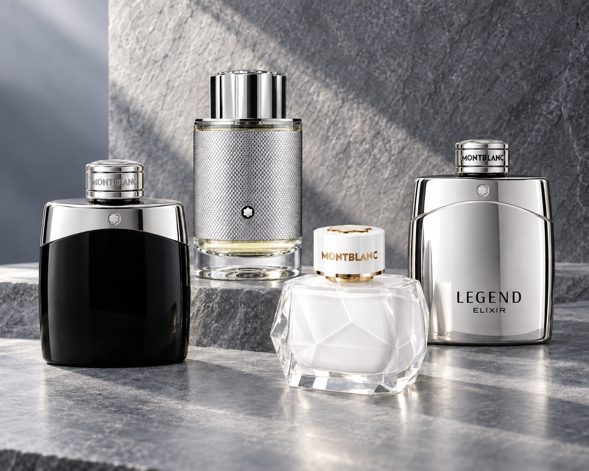 Montblanc Explorer Platinum, Legend, Signature and Legend Elixir bottles on cool grey stone with platinum reflections.