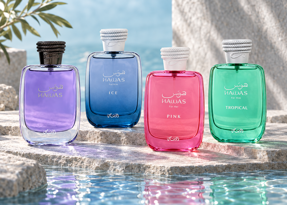 Rasasi Hawas, Hawas Ice, Hawas Pink and Hawas Tropical bottles on pale stone with aquamarine reflections.